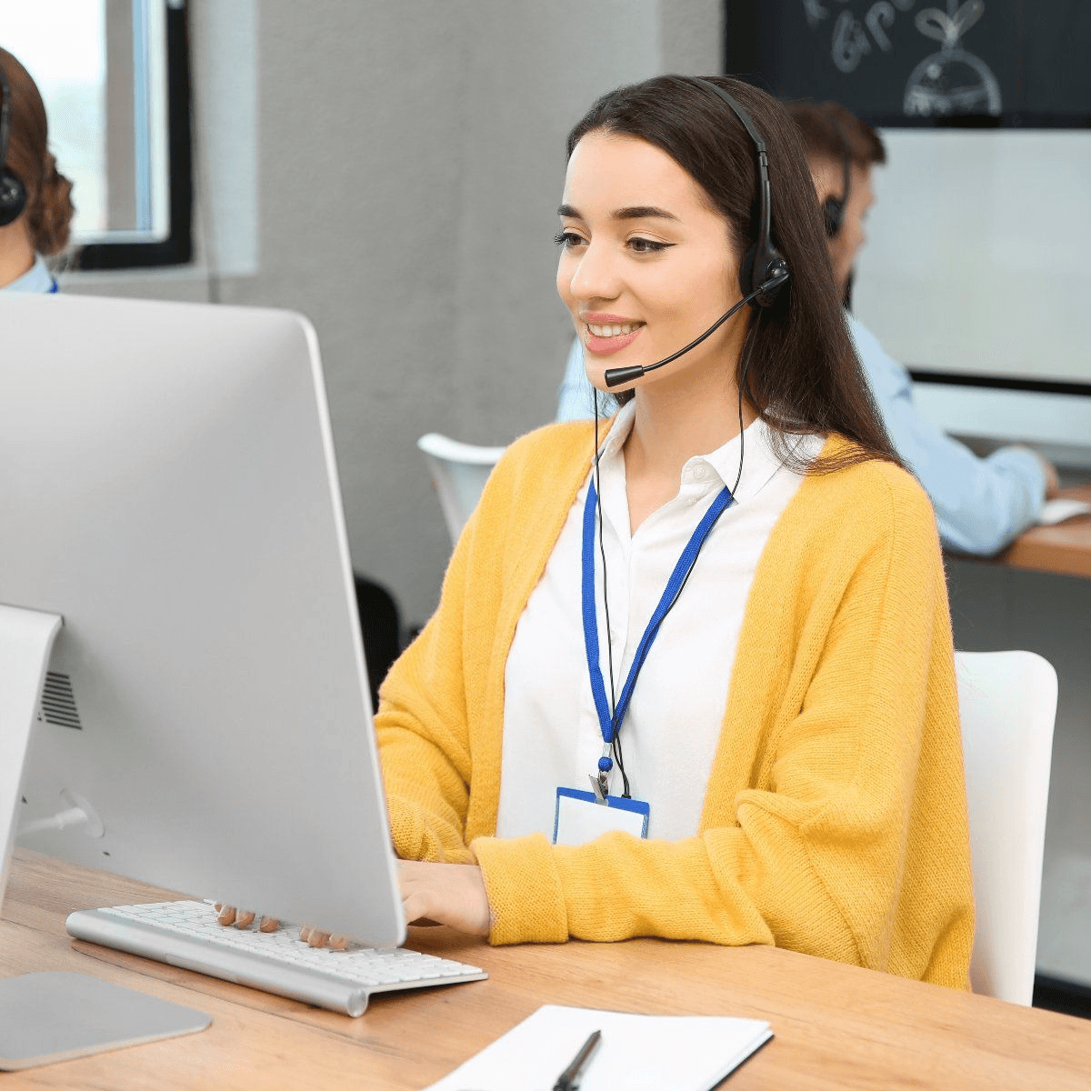 Dial & Acquire agent on a live call, headset on, mid-conversation
